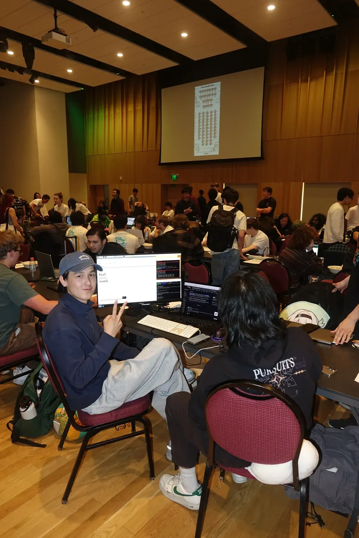 Jakhangir at the team desk with the interface on the monitor